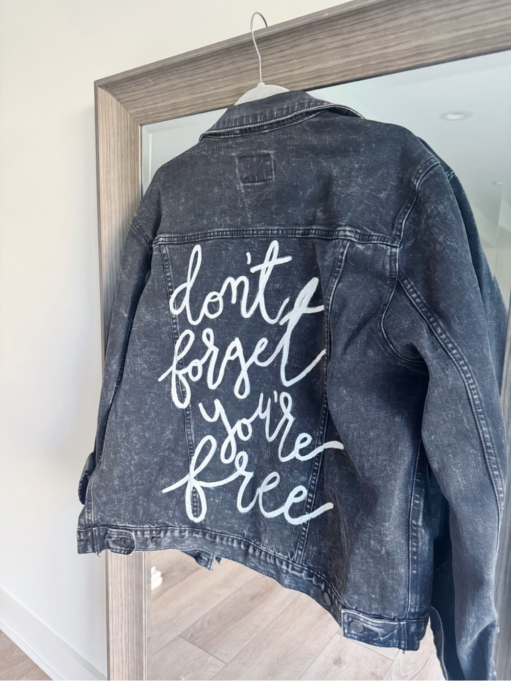 Custom Black Denim Jacket with “Don’t Forget You’re Free” White Script